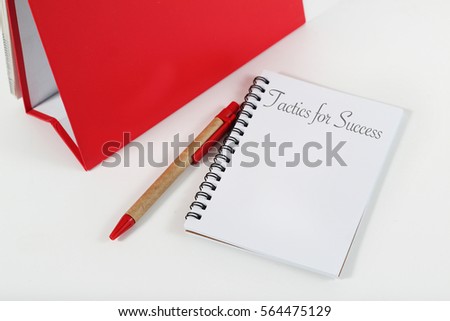 Tactic for Success - Business concept of notebook with pen on white table