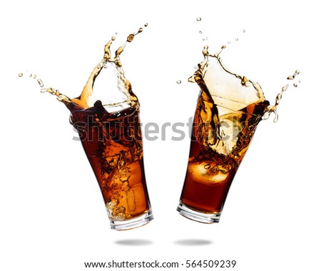 Couple cola splashing out of a glass., Isolated white background. Royalty-Free Stock Photo #564509239