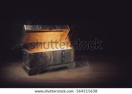 pandoras box with smoke on a wooden background Royalty-Free Stock Photo #564515638