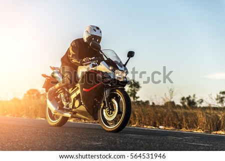motorcycle on sunset Royalty-Free Stock Photo #564531946