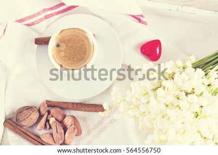 Espresso, croissants, nuts and tangerines on a tray. Romantic breakfast for Valentine's Day, Birthday. Witner decor.