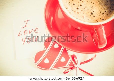 Cappuccino Mug With Wooden Heart and Notes I Love You on Light Rustic Table From Above. Concept Valentine Day. Toned Image. Selective Focus.