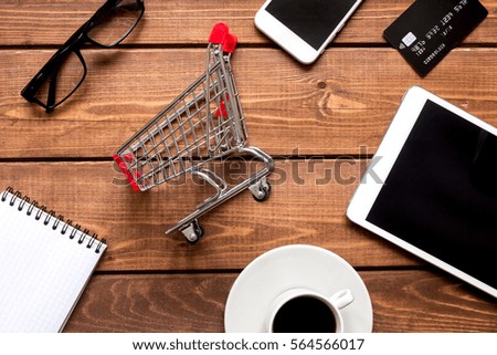 concept online shopping with smartphone on wooden background mock up