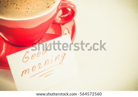 Cappuccino Mug and Notes Good Morning on Light Rustic Table From Above. Toned Image. Selective Focus.