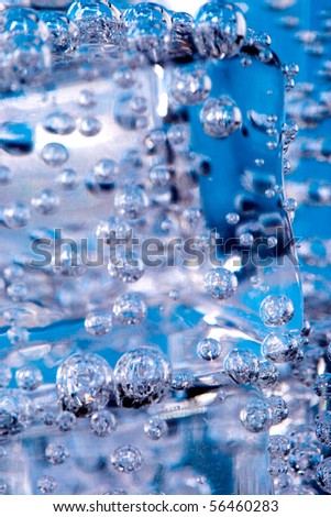 macro image of ice cubes and water bubbles