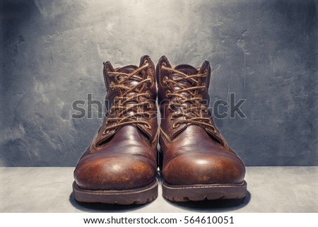 leather shoes on the background of a concrete wall