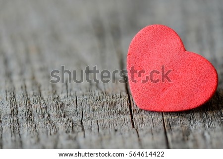 Heart decoration object on wooden background