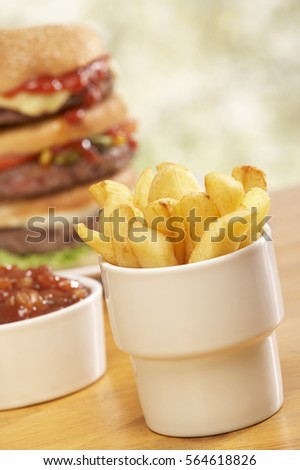 TRIPLE BEEF BURGER WITH CHEESE RELISH PICKLE SALAD ONION RELISH AND CHIPS