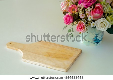 Wood plate for decor and potted roses.