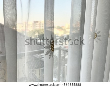 transparent white curtain with view Royalty-Free Stock Photo #564655888