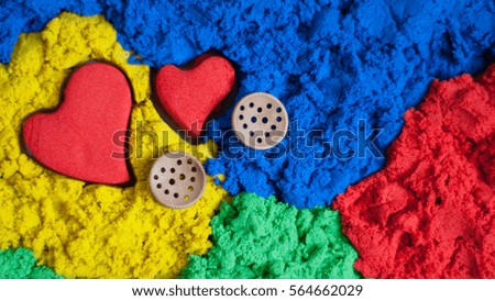 Valentine's Day, 14 February, wooden buttons hearts, texture and color sand hearts in the sand