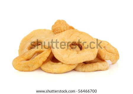 Dried sliced apple rings isolated over white background.