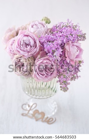 Lovely bunch of flowers .Close-up floral composition with a pink roses on a table. Beautiful bouquet for a birthday or Valentine's Day. Congratulation with a flowers . 