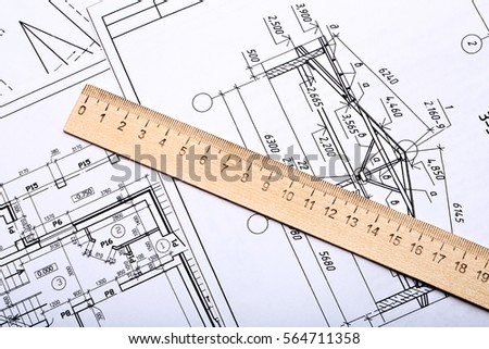 Workplace of architect. Architectural design, sketch, drawing paper, wooden ruler  close-up