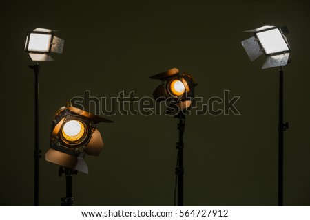 Halogen and led lights. Spotlights with Fresnel lenses. Studio photography. Photo and video shooting.
