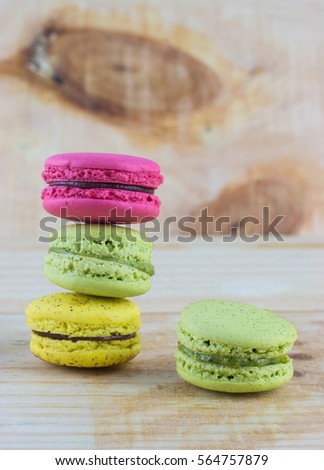 Sweet and colourful french macaroons on wooden background, Dessert.