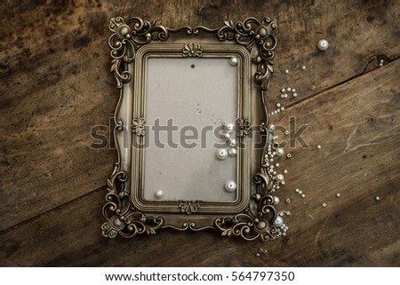  baroque photo frame on wood 