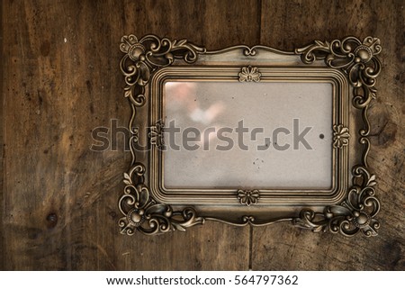  baroque photo frame on wood 