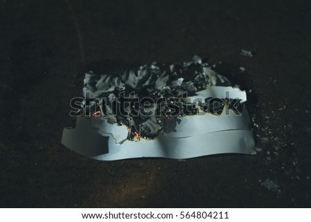 a charred piece of paper