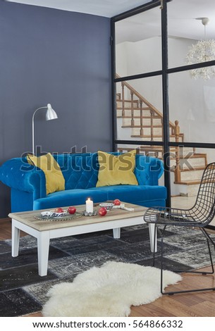 Modern living room is a beautiful house with sofa and armchair steps, large window