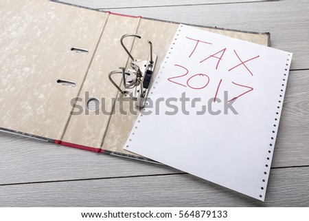 preparing an empty file folder for the tax clearance 2017