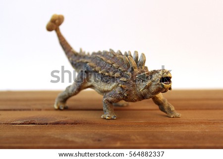 Ankylosaurus dinosaur toy with white background.