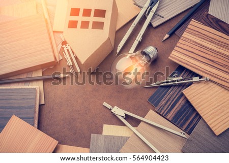 construction and design concept with toy car with wood sample material and drawing tool on leather background