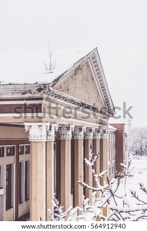 Old abandoned building covered snow