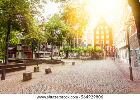 The cozy patio with green in the center of Cologne, Germany. Houses in Bavarian style.