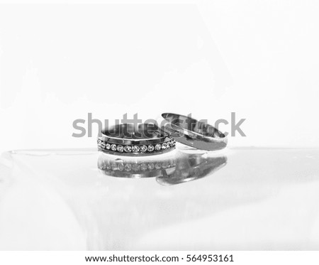 Wedding rings and glass, water