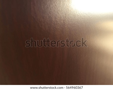Laminated wooden surface background, closeup picture