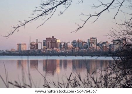 Pink sunset across the Charles River in Boston