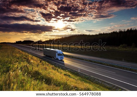 Truck transportation at sunset Royalty-Free Stock Photo #564978088
