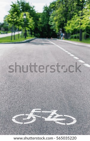 Sign of a bike on the road in the park