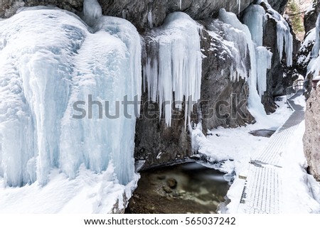 Hiking trail through a narrow gorge covered with snow and ice, mountain range Little Fatra, Slovakia, Europe.