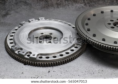 Set to replace the automobile clutch (composed of damping flywheel, drive and basket) on a metal background