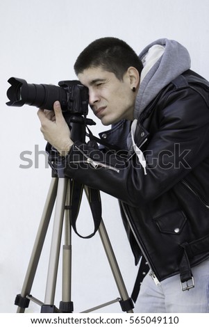 Photographer with camera and tripod 