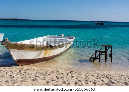 A boat moored to the shore. Beautiful view from the Paradise Island near Hurghada  to Red Sea