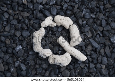 White Death Coral alphabet on coal black stone backgrounds