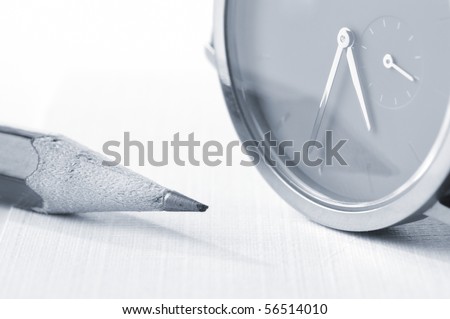 watch and pencil closeup