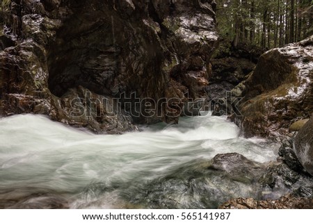 River stream running in the beautiful rock formed canyon. Picture taken in Lynn Valley, North Vancouver, British Columbia, Canada.