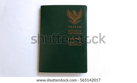 blur image of green passport book Indonesian citizens isolated on white background, low light,   