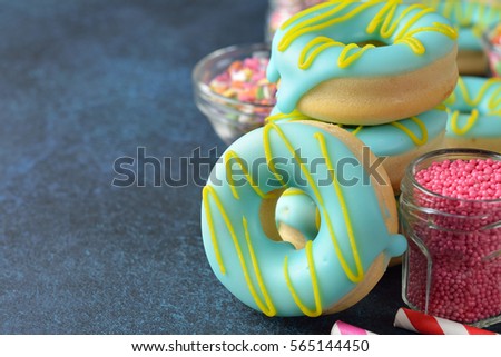 Sweet donuts decorated with icing