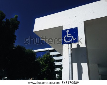 Reserved sign or wheelchair sign entrance for handicapped people to building.