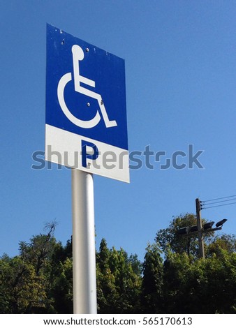 Disabled parking sign on street