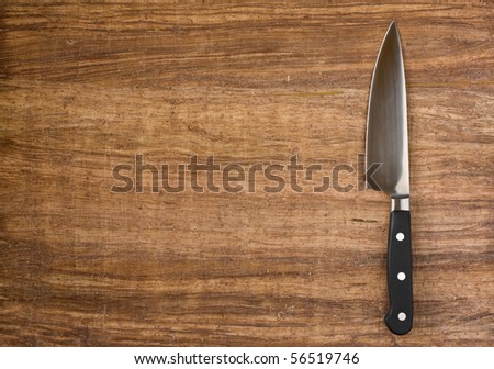 Knife on rustic kitchen table with copy space Royalty-Free Stock Photo #56519746