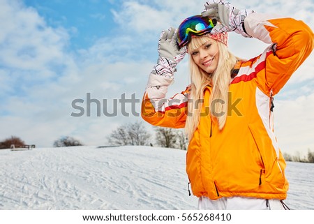 Woman on the background of snow winter and mounts