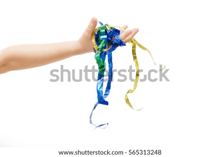 Hand holds colored ribbons on a white background