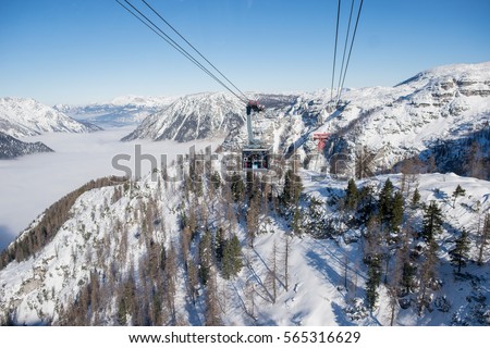 Travel with elevator up to the snowy mountains
