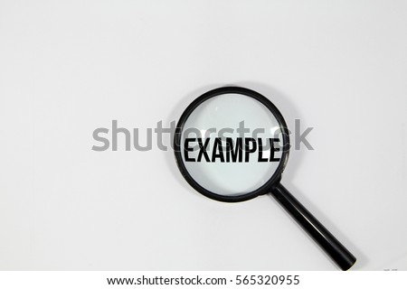 A concept image of a magnifying glass isolated white background with a word EXAMPLE zoom inside the glass  Royalty-Free Stock Photo #565320955